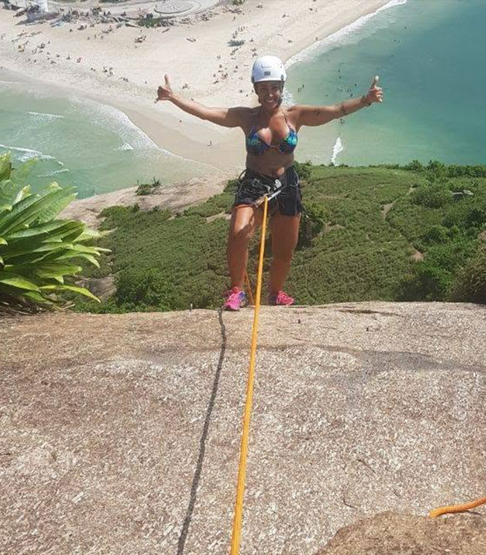Woman posing with rope during Brazil hiking accident near beach Woman posing with rope during Brazil hiking accident near beach