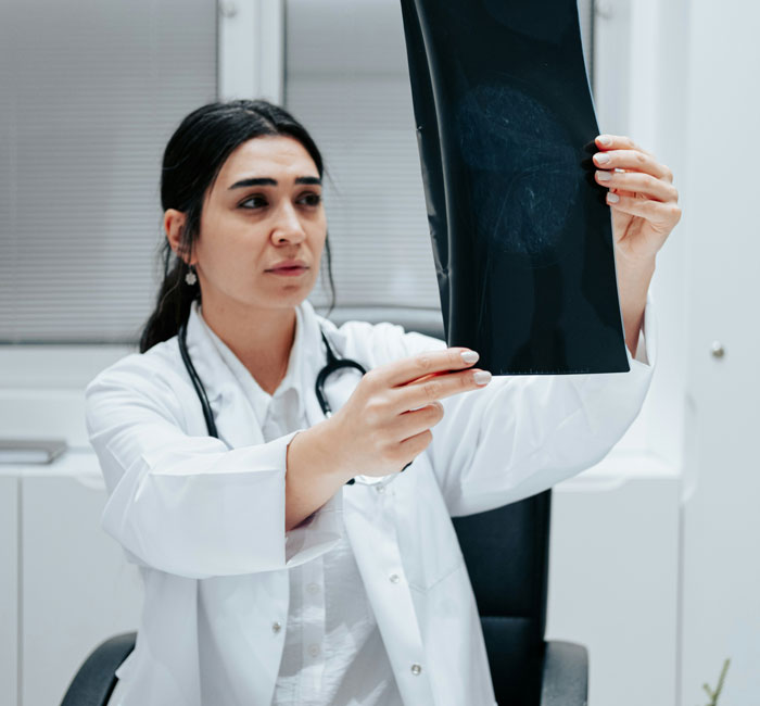 Doctor analyzing x-ray image in medical office