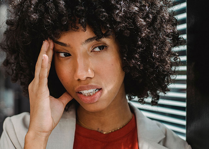 Young woman anxious about mother in law causing wedding problems