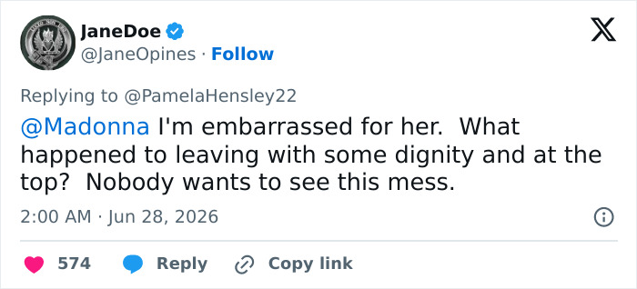 A tweet from JaneDoe expressing embarrassment for Madonna's Time Square performance, asking about dignity.