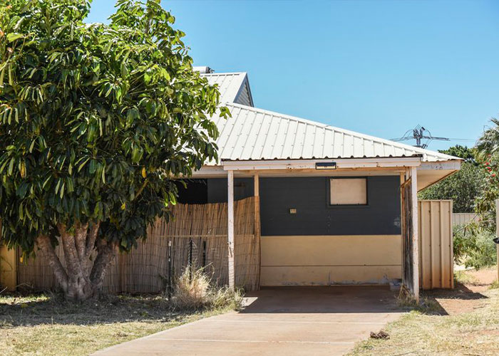 Small house with tree and empty driveway linked to campsite girl disappearance case Small house with tree and empty driveway linked to campsite girl disappearance case