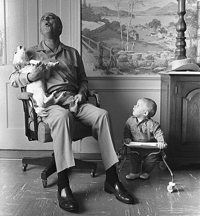 World leader playing with dog and interacting with child in a wholesome moment