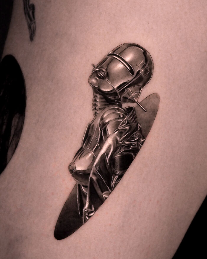 Chrome Cyborg Gliding From An Oval Portal