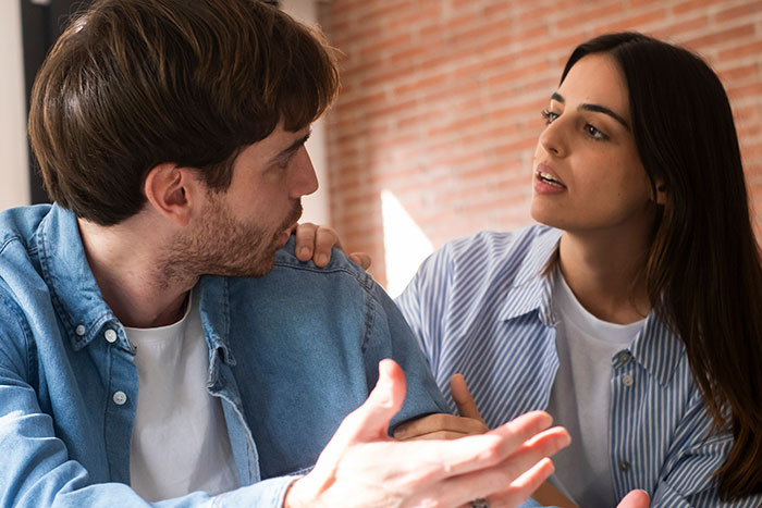 Couple having a serious conversation about setting boundaries with MIL