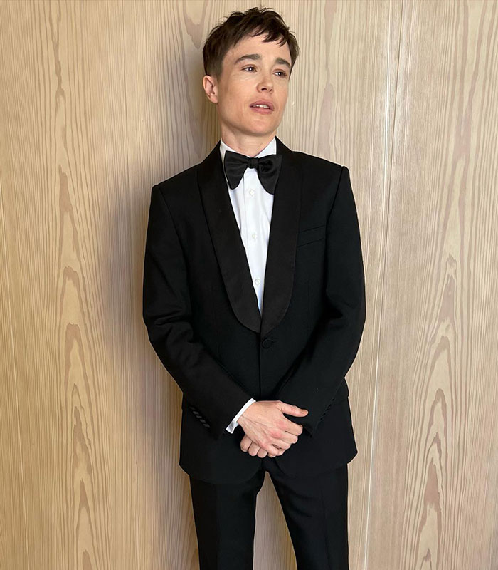 Elliot Page shows off his shredded physique while looking sharp in a tuxedo, reflecting his boxing journey.