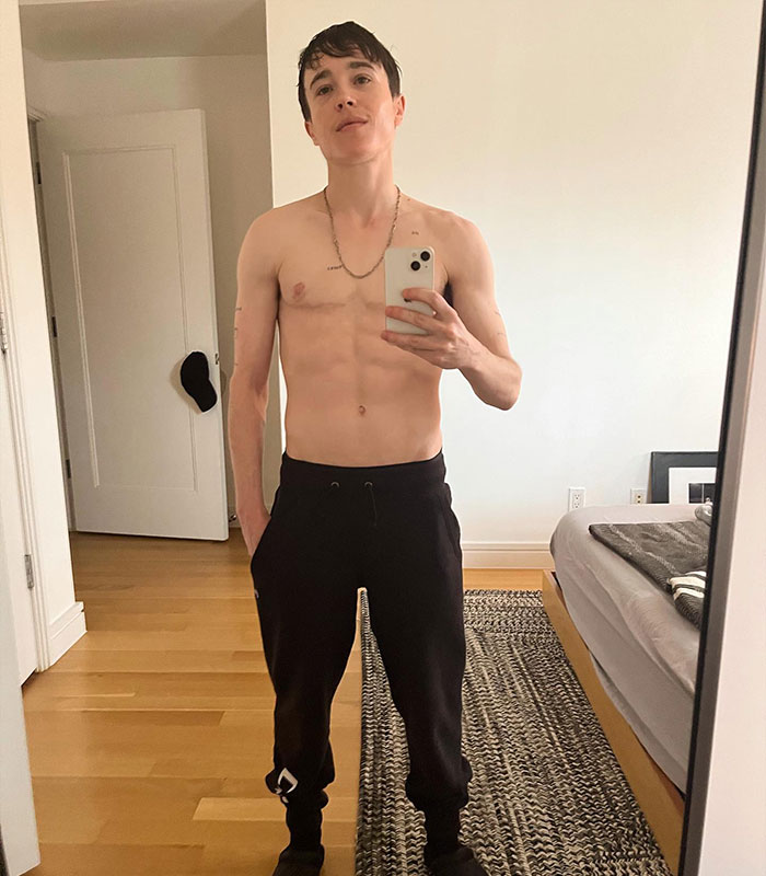 Elliot Page reveals his shredded physique in a mirror selfie, proudly displaying the results of boxing.