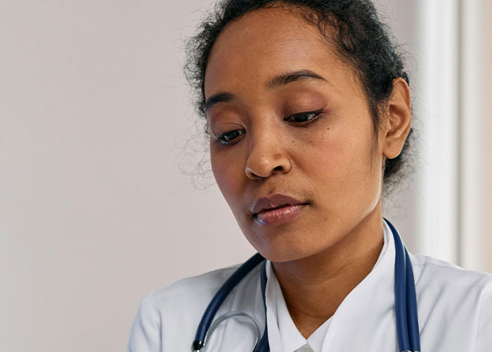 Doctor with stethoscope looking thoughtful about wild secrets taken to graves