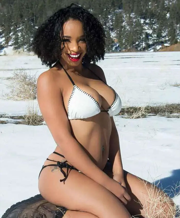 California housewife in a bikini smiling outdoors on a snowy day California housewife in a bikini smiling outdoors on a snowy day
