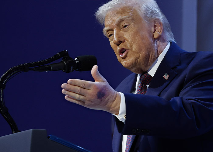 President delivering speech at podium with strong gesture President delivering speech at podium with strong gesture