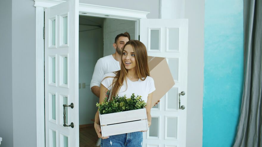 Happy couple moving into new home representing fresh start in relationships