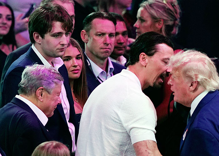 Barron Trump at UFC event with group of people looking concerned Barron Trump at UFC event with group of people looking concerned