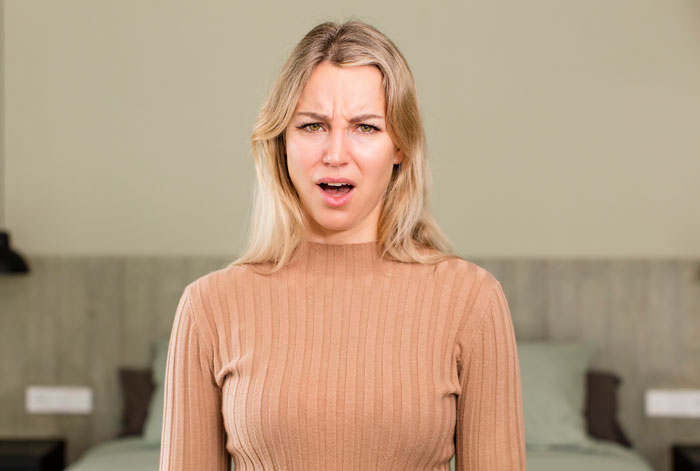 A woman with a confused expression, highlighting myths about women.