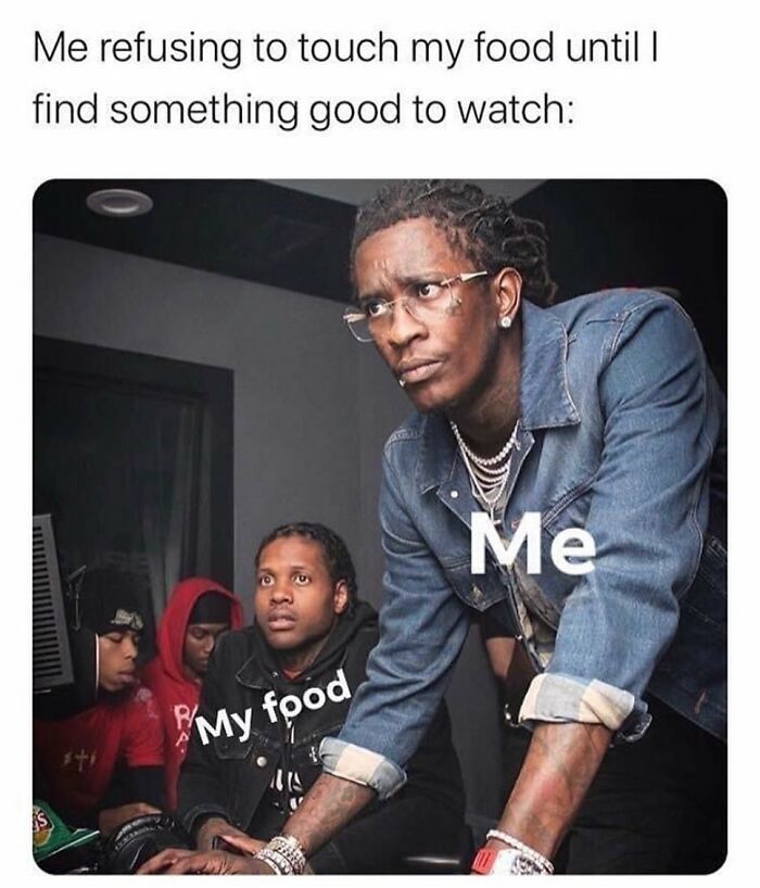 Meme of focused man refusing food while searching for something to watch