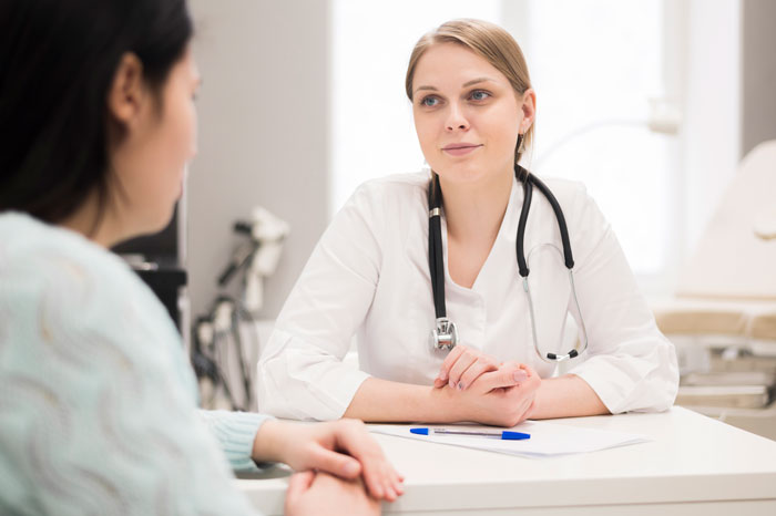 Female doctor attentively listening to patient