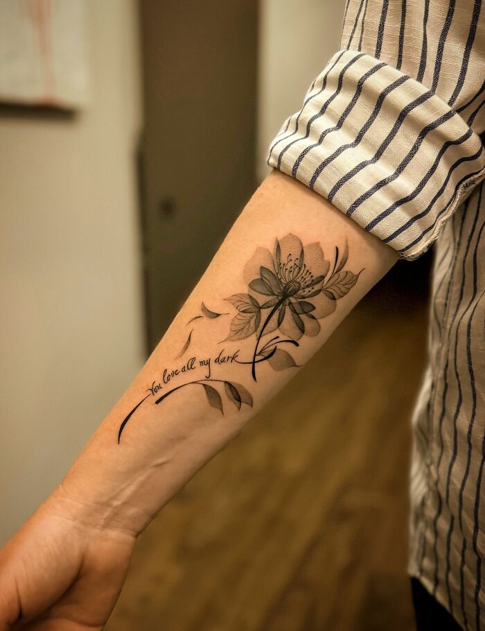 Forearm tattoo with floral design symbolizing strength in setting boundaries Forearm tattoo with floral design symbolizing strength in setting boundaries