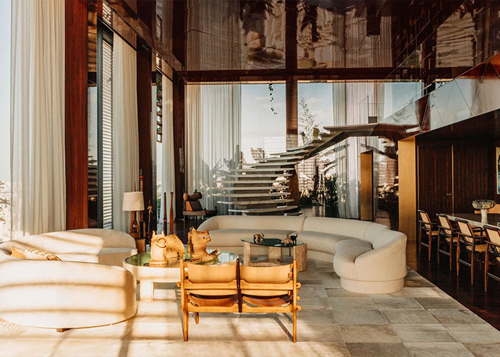Luxurious hotel living room with modern furniture and large windows Luxurious hotel living room with modern furniture and large windows
