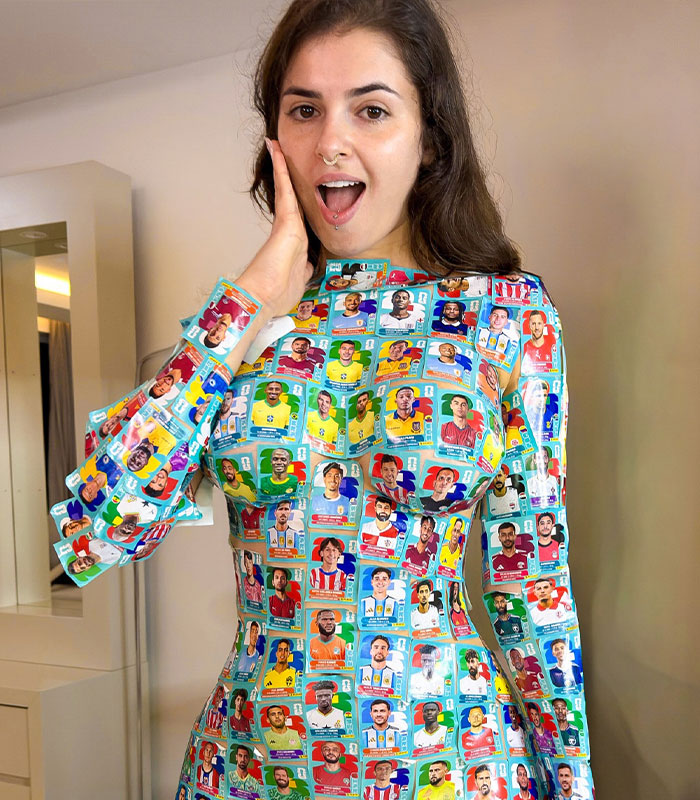Woman wearing outfit made from numerous World Cup soccer stickers