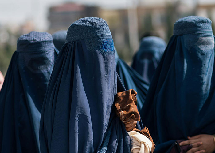 Women wearing burqas representing legal offense and cultural clothing