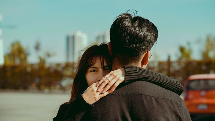 A couple embracing on a date, illustrating acceptable actions and dynamics in dating.