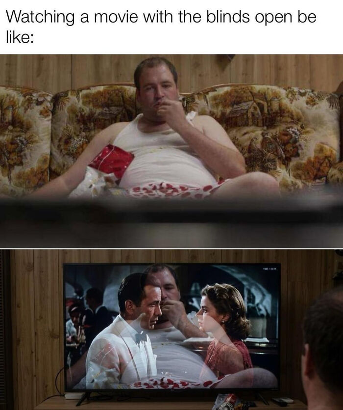 A blursed meme showing a man on a couch watching a movie on TV, with light from the window reflecting on the screen.