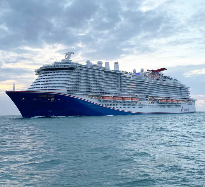 Carnival cruise ship on the ocean at sunset