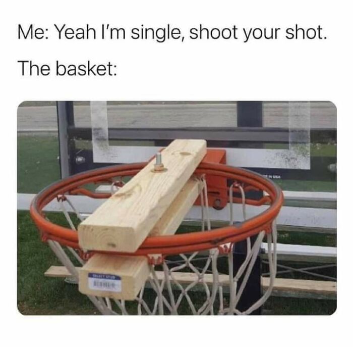 A humorous meme depicting a basketball hoop blocked by wooden planks, representing a blocked shot.