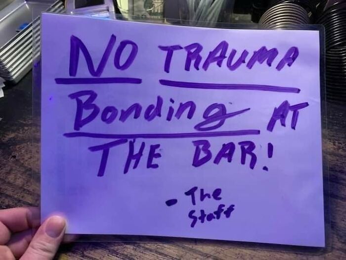 A meme showing a handwritten sign that says NO TRAUMA Bonding AT THE BAR! - The Staff.