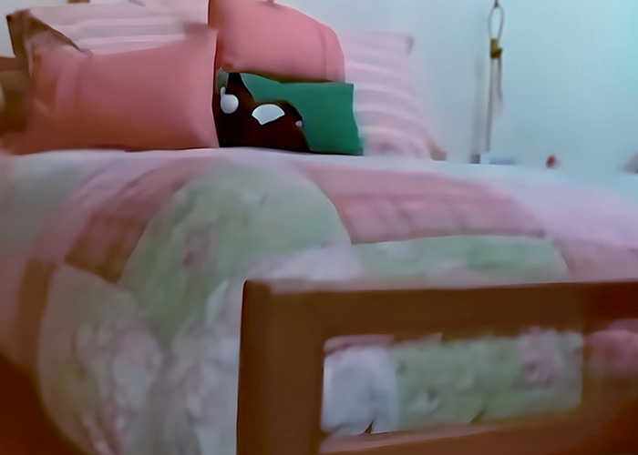 Blurred bedroom with bed where 4-year-old girl was found