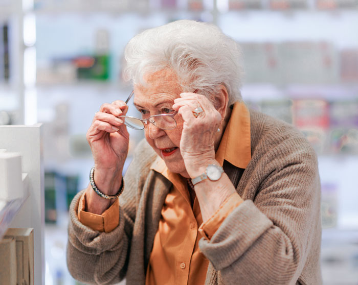 Audacious 85-year-old woman checking medications at pharmacy Audacious 85-year-old woman checking medications at pharmacy