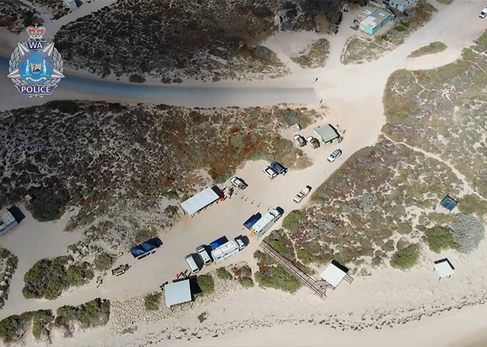 Aerial view of police search and investigation at remote campsite Aerial view of police search and investigation at remote campsite