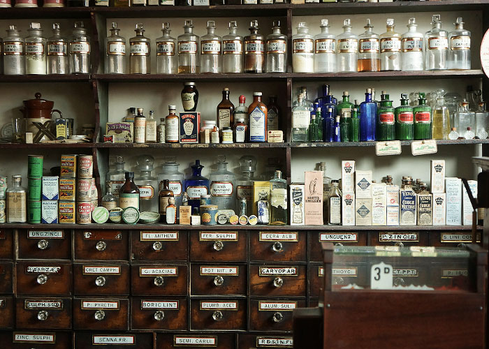 Antique pharmacy shelves with old bottles connected to marriage mystery Antique pharmacy shelves with old bottles connected to marriage mystery