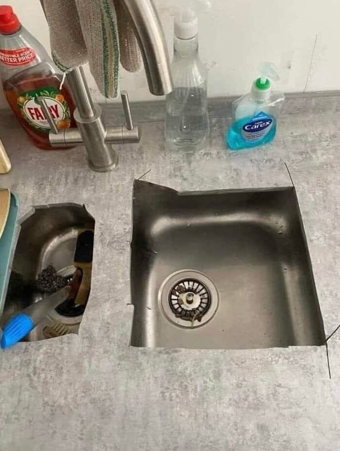 Poorly cut kitchen countertop around sink showing design fail