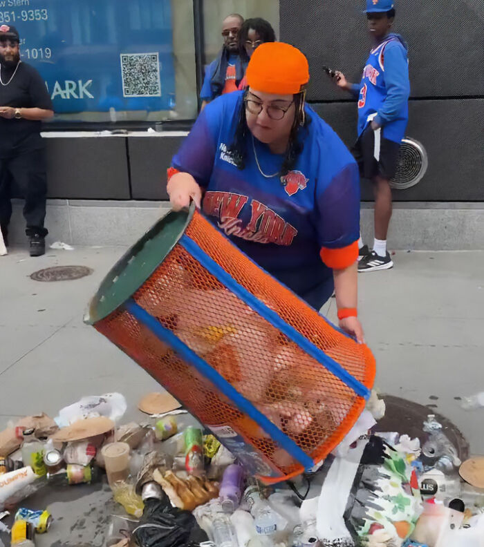 A JPMorgan exec in a Knicks jersey emptying a trashcan onto the street, facing karma in an update. A JPMorgan exec in a Knicks jersey emptying a trashcan onto the street, facing karma in an update.