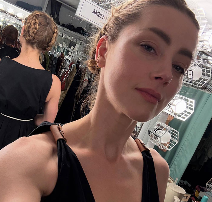 Amber Heard new photos: a selfie of Amber Heard in a black top with her hair braided, looking at the camera. Amber Heard new photos: a selfie of Amber Heard in a black top with her hair braided, looking at the camera.