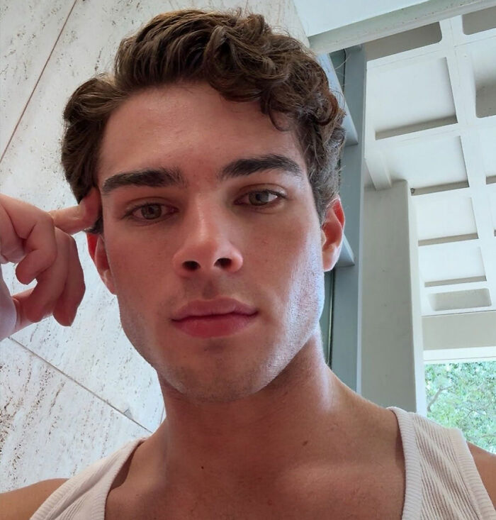 Looksmaxxer Clavicular close-up selfie highlighting facial features