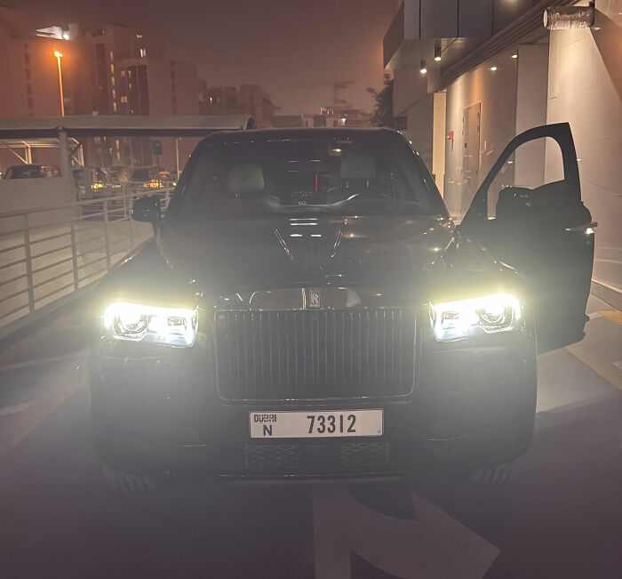 Luxury car parked at night in Dubai; influencer arrested in Dubai on grave charges.