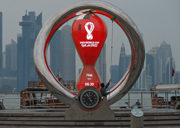 FIFA World Cup 2022 countdown clock sculpture with Doha skyline in background