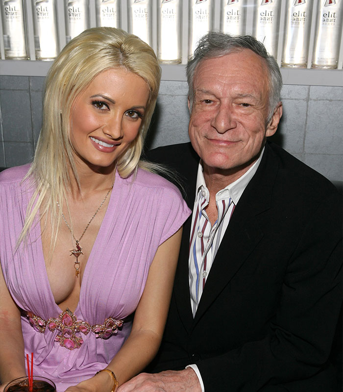 Holly Madison and Hugh Hefner together behind the gates of the mansion Holly Madison and Hugh Hefner together behind the gates of the mansion