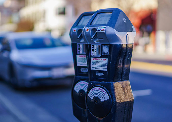 Parking meters on city street, legal offense parking regulations