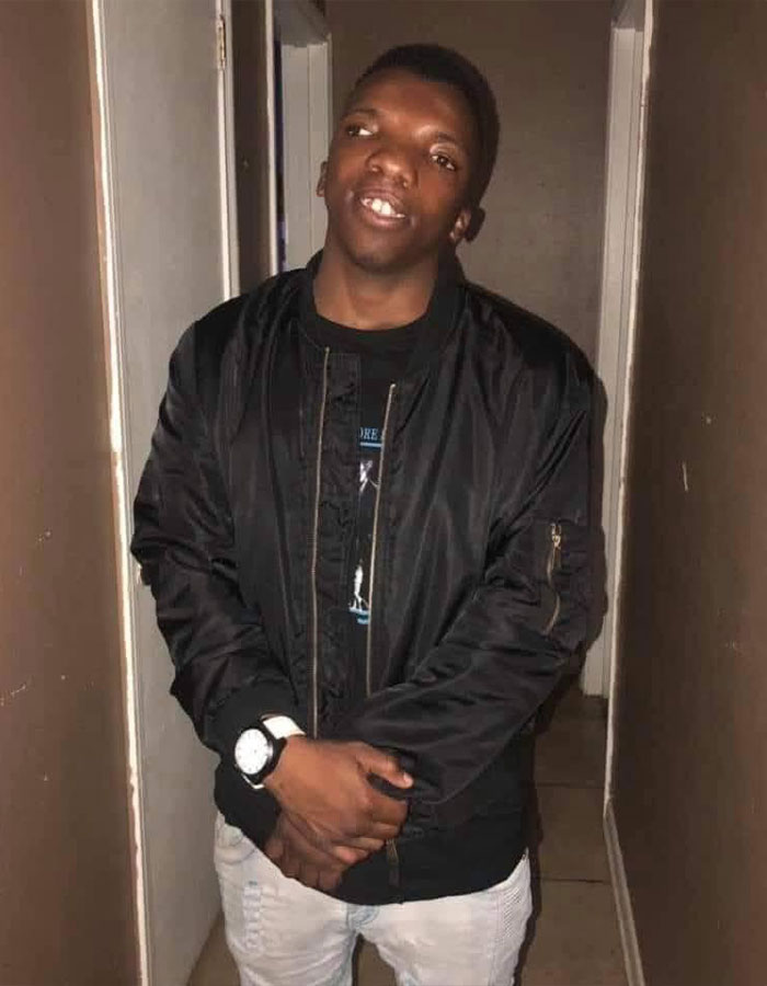 Young man in black jacket posing indoors in Baton Rouge Young man in black jacket posing indoors in Baton Rouge