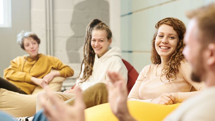 Group of young people discussing mind-bending dilemmas in a casual setting
