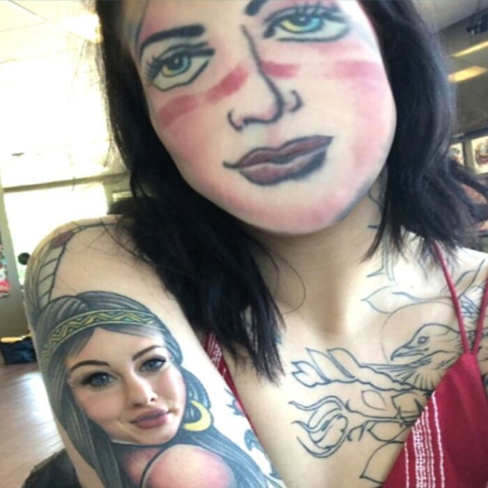 A woman with a face tattoo mimicking the style of her arm tattoo, creating a hilarious tattoo fail.