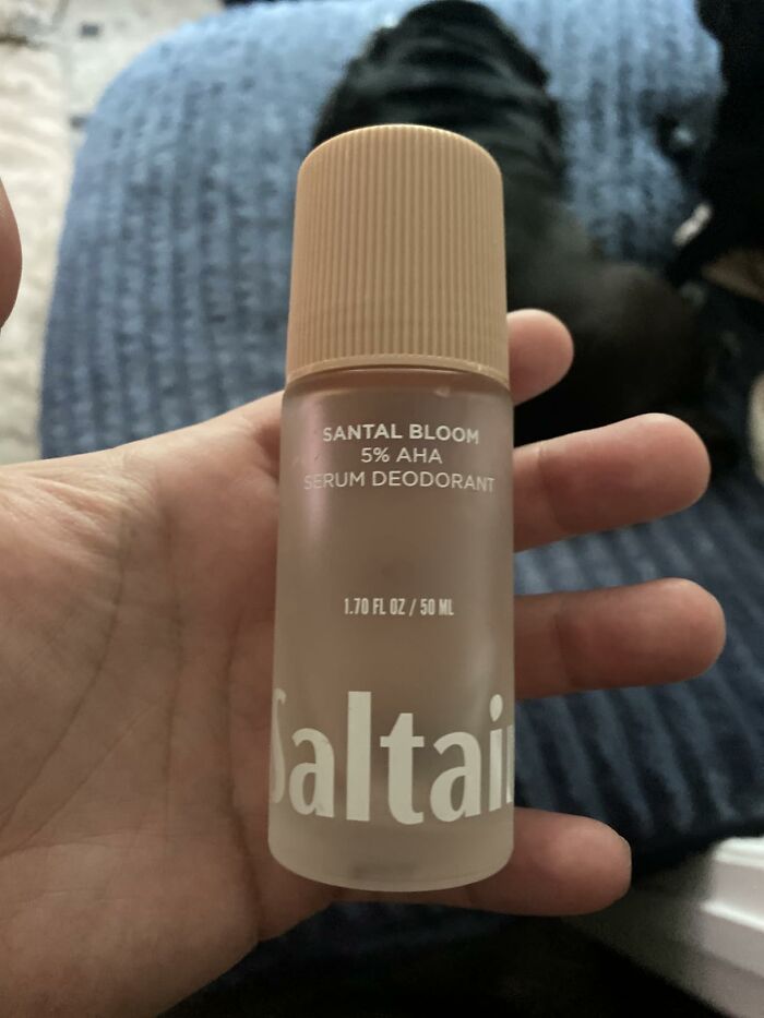 Hand holding Saltair Santal Bloom serum deodorant, an essential for a fresh summer, perfect for Prime Day deals.