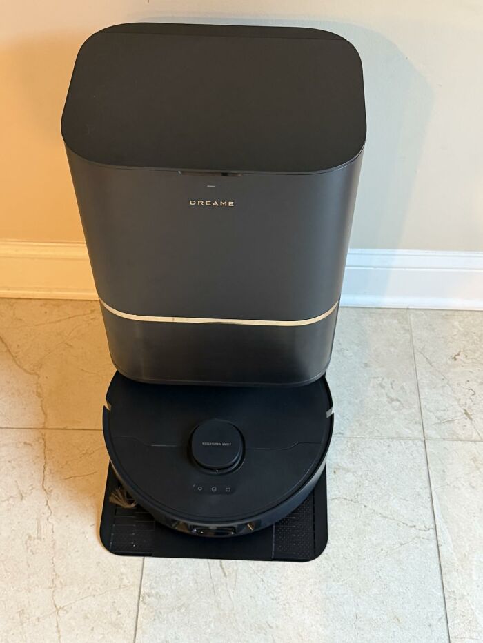 A black robotic vacuum cleaner with a self-emptying base, a convenient home find on sale for Prime Day.