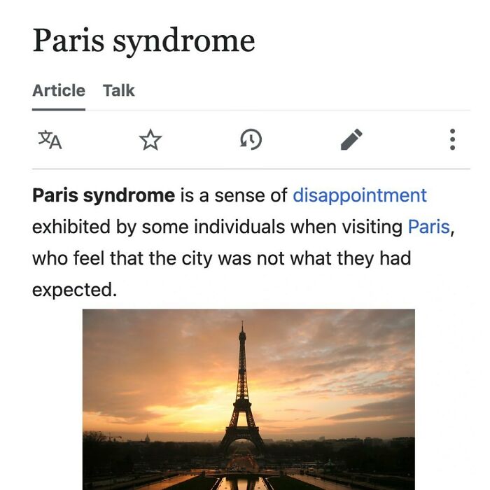 Wikipedia article excerpt on Paris syndrome with Eiffel Tower image at sunset