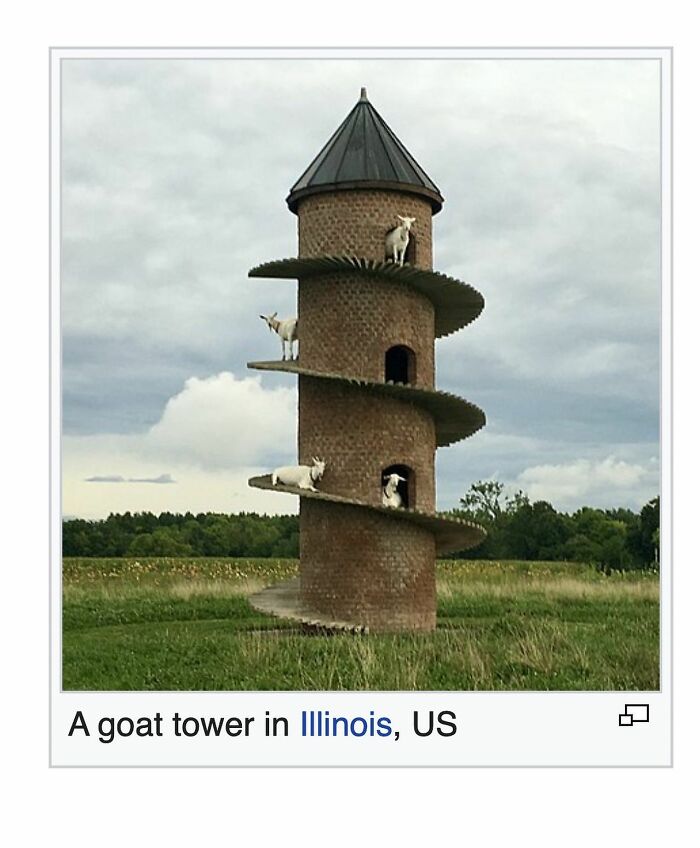 Goat tower structure in Illinois with goats on spiral steps