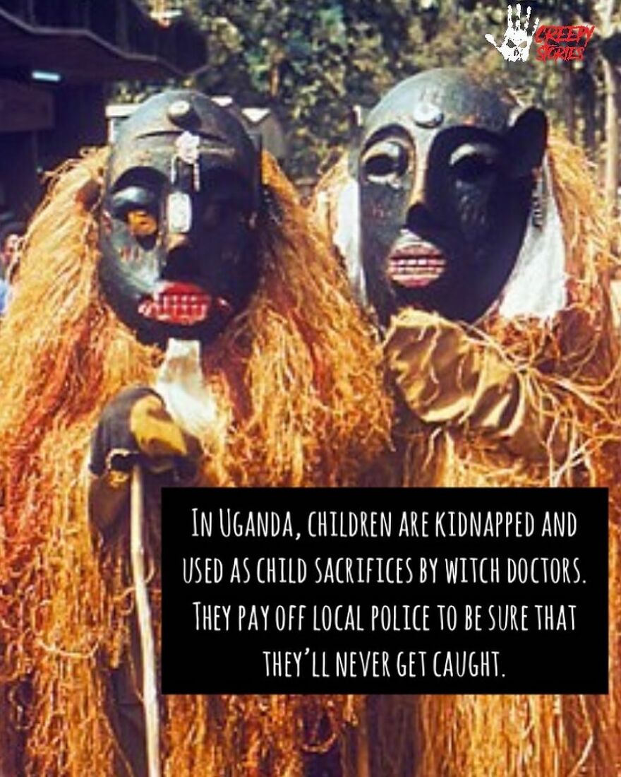 Two masked figures representing witch doctors, a terrifying fact of child sacrifices in Uganda.