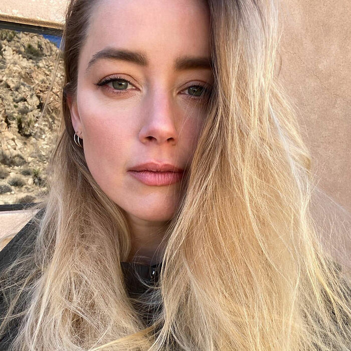 Amber Heard shares a close-up photo of her new life, showcasing her new look in her new country. Amber Heard shares a close-up photo of her new life, showcasing her new look in her new country.