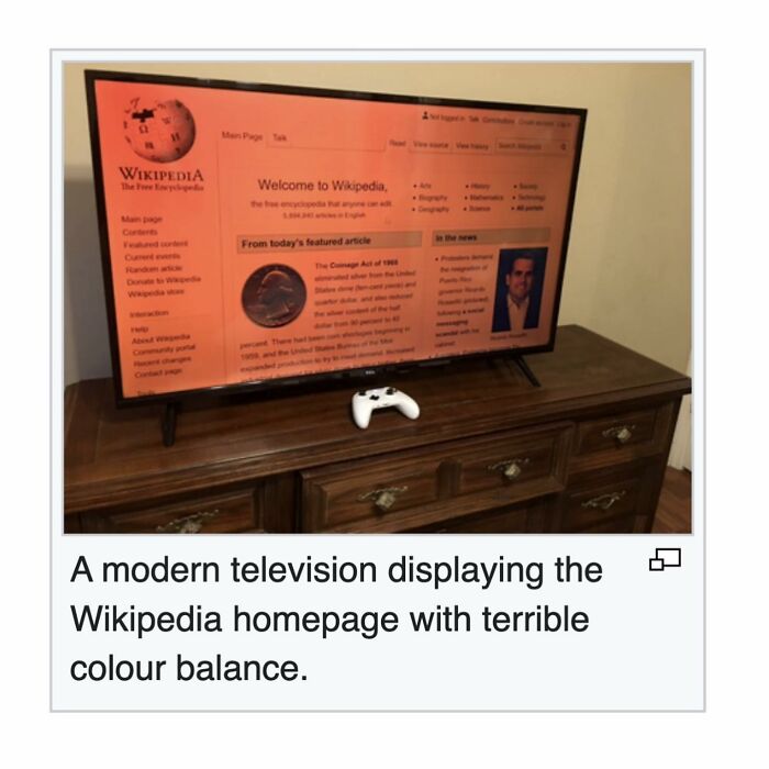 Modern television showing Wikipedia homepage with poor color balance