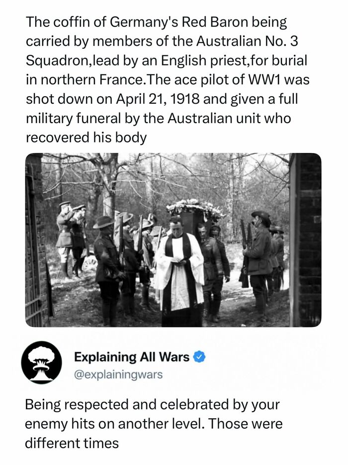Black and white image of the Red Baron's coffin carried by Australian soldiers and an English priest, explaining all wars.